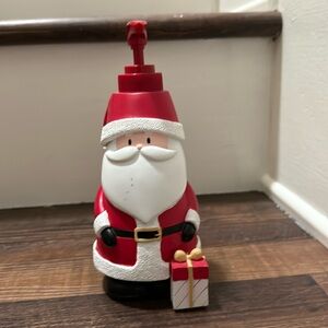 Santa Claus lotion dispenser that present lights up